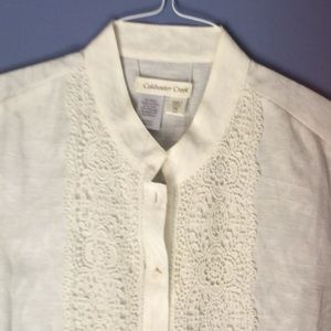 Cream colored blouse.